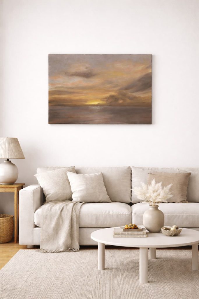 50x70 cm minimalist sunset seascape painting displayed above a beige sofa in a modern neutral living room