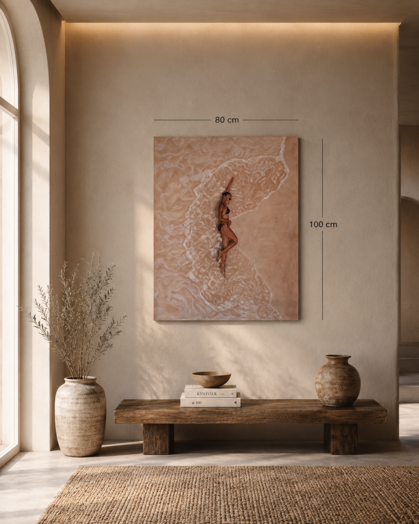 Original oil painting on canvas showing a top-down aerial view of a beach with gentle waves and a reclining woman resting on the sand, rendered in warm sandy tones with a minimalist composition.